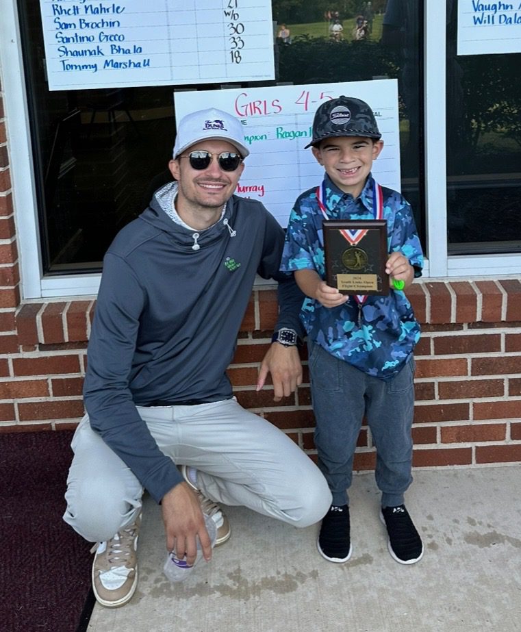 Coach Mike working with a young junior golfer at Mike’s Golf Center